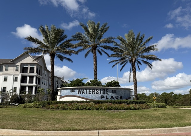Waterside Place at Lakewood Ranch, Florida, with palm trees and surrounding buildings
